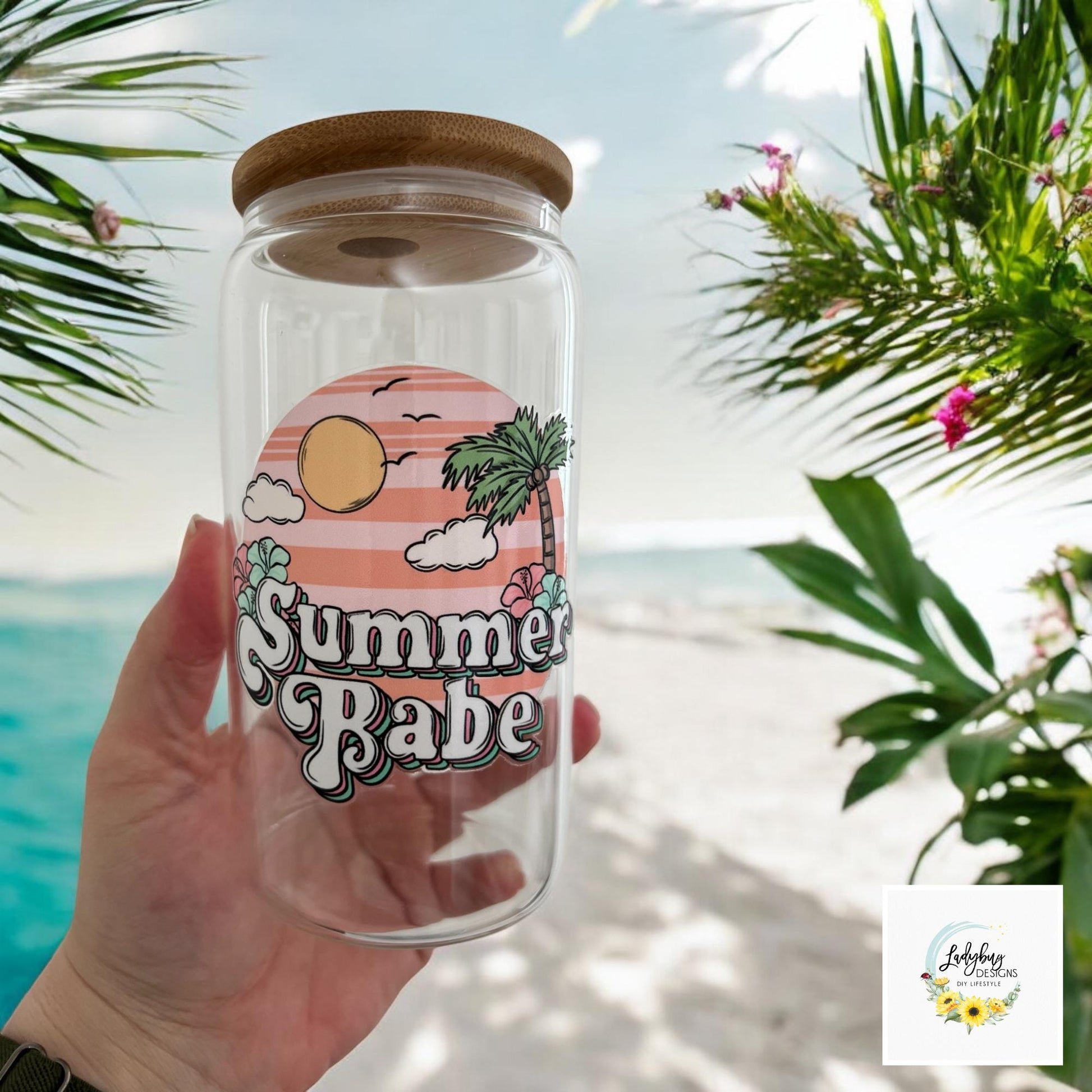 Summer Babe Sarcastic Cup with bamboo lid and plastic straw. Features a 16 oz beer can glass design with permanent UV DTF transfer. Perfect for iced coffee and summer vibes. Ideal as a funny and sarcastic gift, with hand wash care instructions.