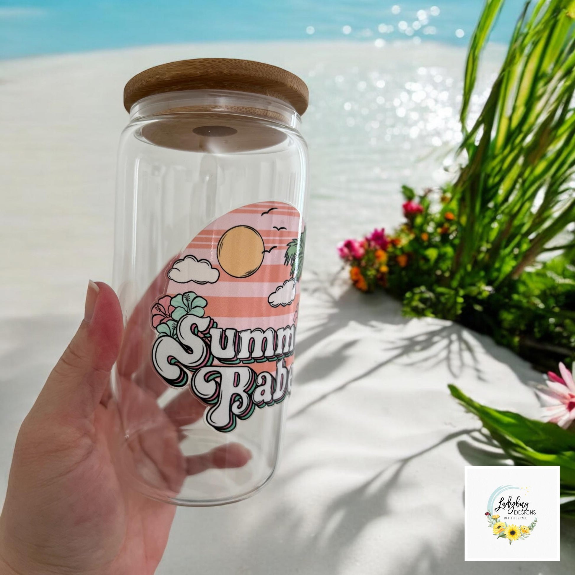 Summer Babe Sarcastic Cup with bamboo lid and plastic straw. Features a 16 oz beer can glass design with permanent UV DTF transfer. Perfect for iced coffee and summer vibes. Ideal as a funny and sarcastic gift, with hand wash care instructions.