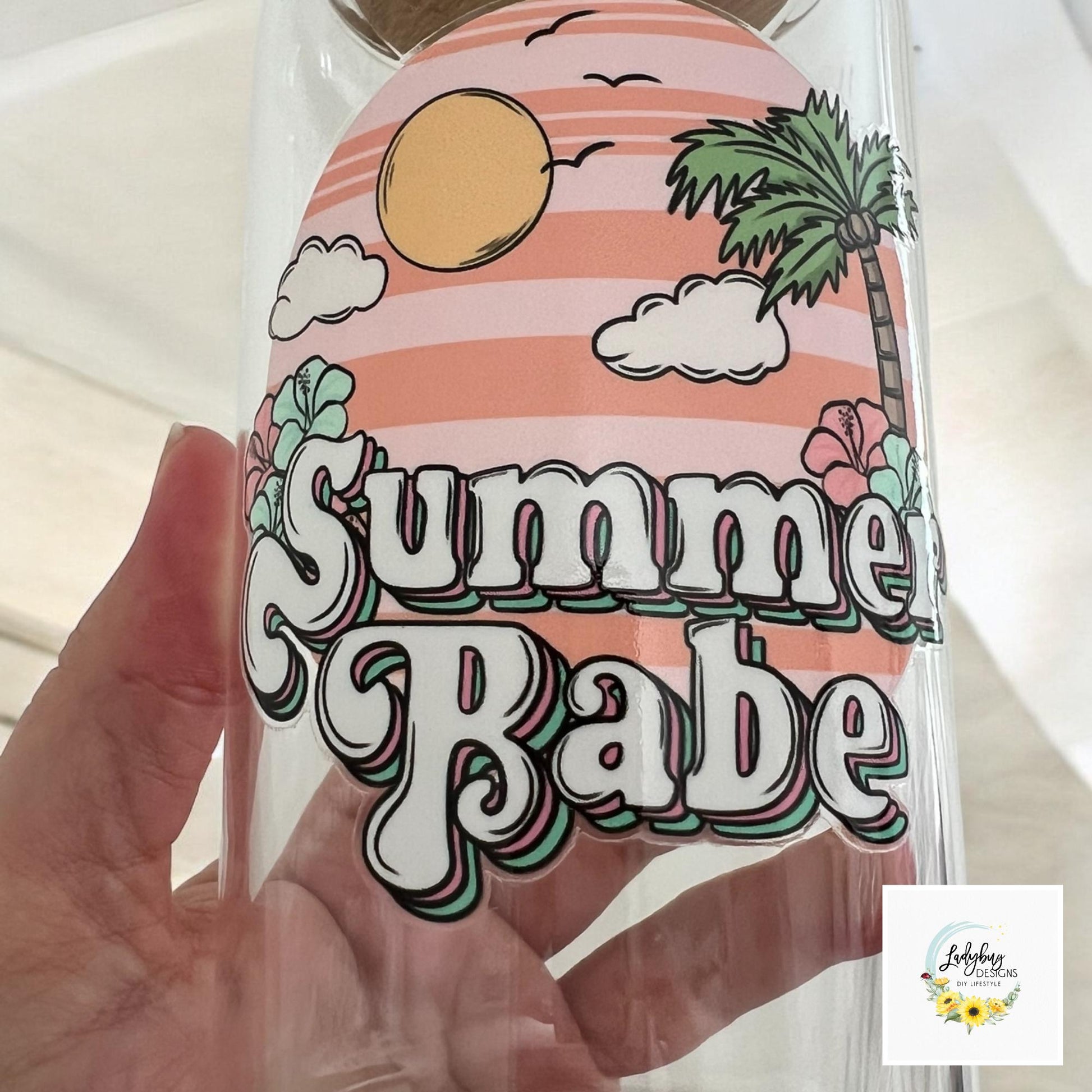 Summer Babe Sarcastic Cup with bamboo lid and plastic straw. Features a 16 oz beer can glass design with permanent UV DTF transfer. Perfect for iced coffee and summer vibes. Ideal as a funny and sarcastic gift, with hand wash care instructions.