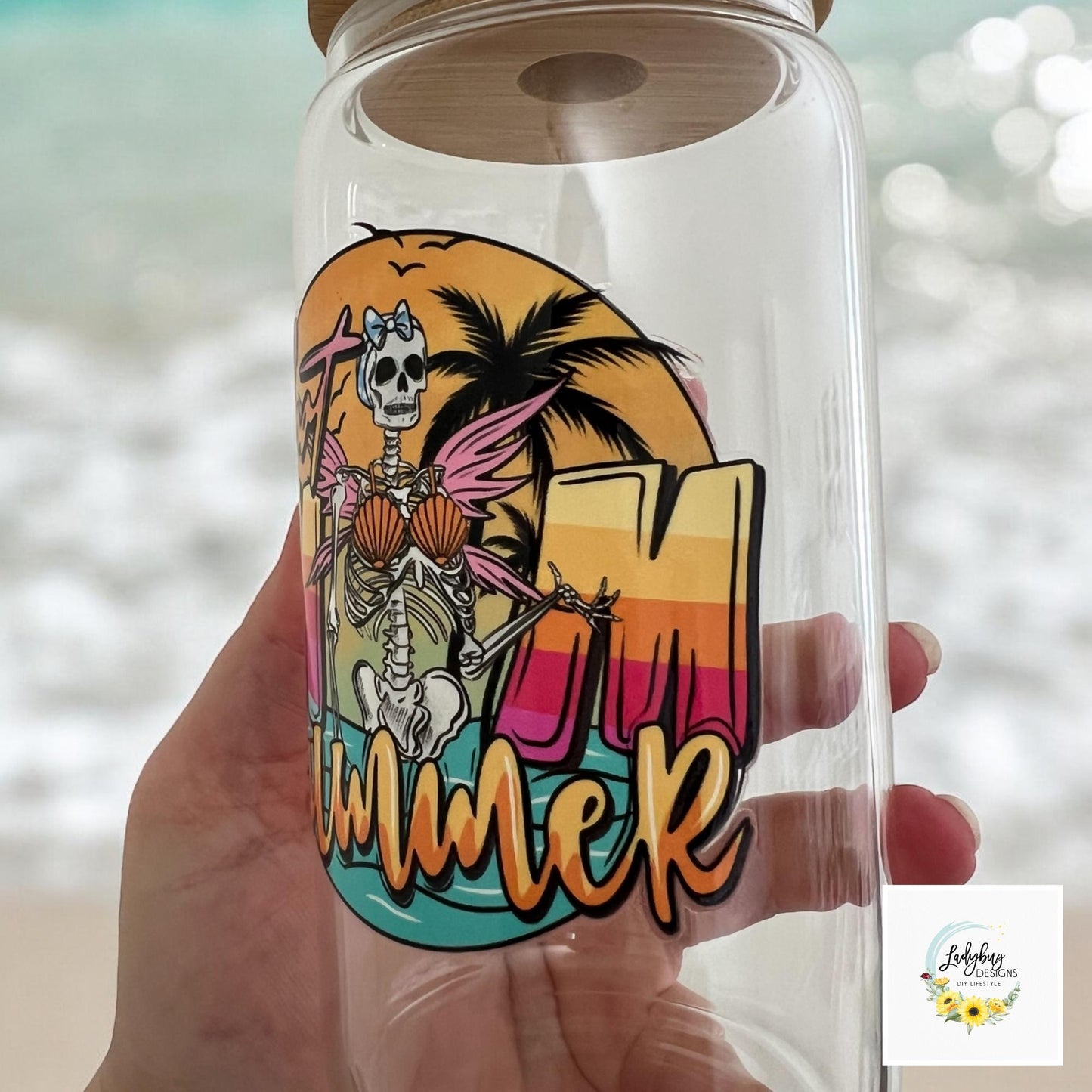 Hot Mom Summer Cup with bamboo lid and plastic straw. Features a 16 oz beer can glass design with permanent UV DTF transfer. Perfect for iced coffee and summer vibes. Ideal as a funny and sarcastic gift, with hand wash care instructions.